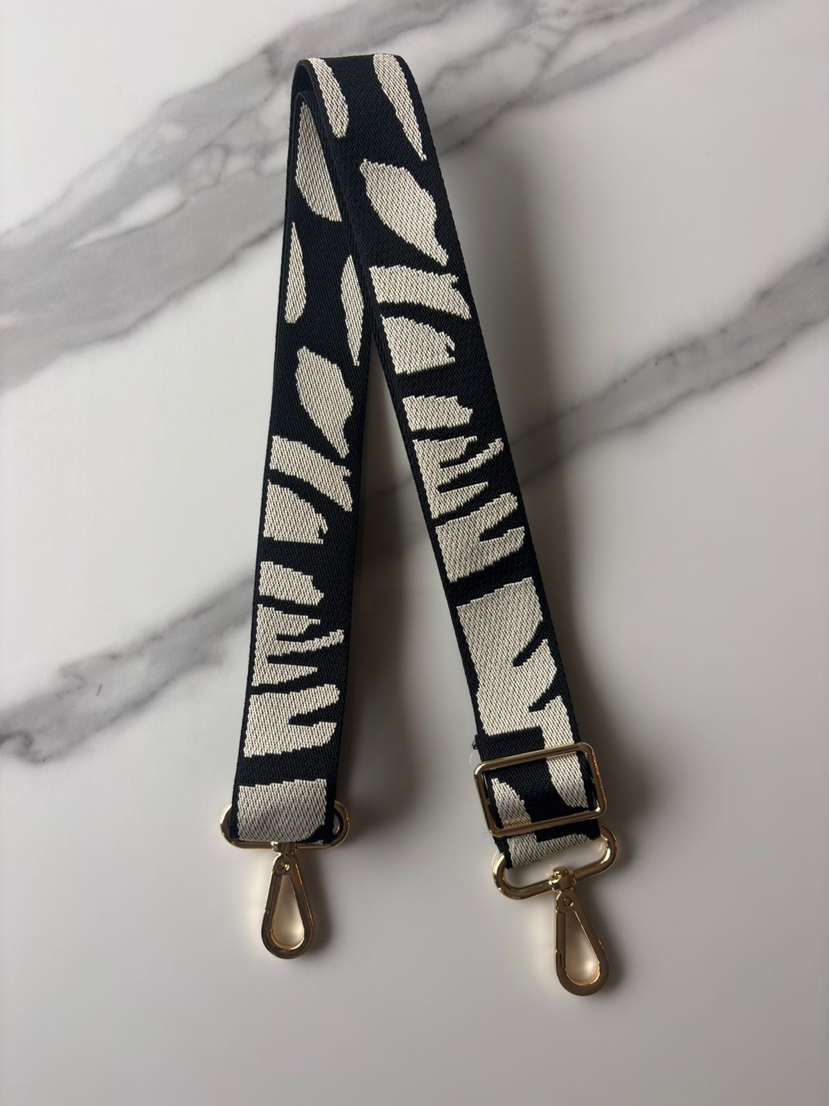 Strap negro manchas beige